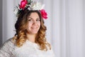 Portrait of beautiful woman in white dress and wreath Royalty Free Stock Photo