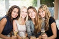 Portrait of beautiful women having drinks