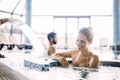 Portrait of beautiful woman relaxing in swimming pool Royalty Free Stock Photo