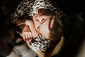 Portrait of beautiful yang blond woman laying in sunlights and shadows