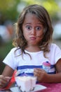 portrait of a beautiful 4 year old girl who makes funny faces Royalty Free Stock Photo