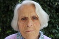 Portrait of a beautiful 90 year old woman. Upset thoughtful mature woman, feeling unwell, lost in thoughts, dementia or Royalty Free Stock Photo