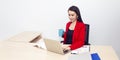 Portrait of beautiful 20-30 years.Young businesswoman in red suit