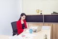 Portrait of beautiful 20-30 years.Young businesswoman in red suit