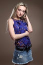 Portrait of a beautiful young adult slim and attractive sensuality pretty blonde woman in blue elegance fashionable shorts an Royalty Free Stock Photo