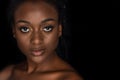 portrait of beautiful young african american woman with water drops on face looking at camera Royalty Free Stock Photo