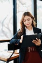 portrait of Beautiful young asian businesswoman presents business profits to colleagues at meeting, explaining business Royalty Free Stock Photo