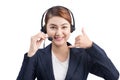 Portrait of beautiful young asian female customer service representative in headset looking at camera and smiling while isolated Royalty Free Stock Photo