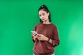 Portrait beautiful young Asian girl holding a phone while looking at the camera Royalty Free Stock Photo