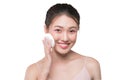 Portrait of beautiful young asian model applying some powder using powder puff Royalty Free Stock Photo