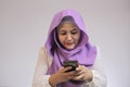 Muslim Woman Angry While Reading Text Message on Smart Phone Royalty Free Stock Photo