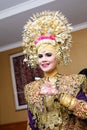 Portrait of beautiful young Asian muslim woman wearing traditional Minangkabau ethnic traditional dress being prepared for wedding