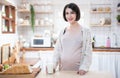 Portrait beautiful young asian pregnant woman drink milk glass standing in kitchen at home.Health care and love of pregnancy Royalty Free Stock Photo