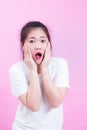 Portrait of beautiful Young Asian woman black hair wear a white t-shirt. with shocked facial expression. Royalty Free Stock Photo