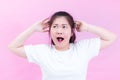 Portrait of beautiful Young Asian woman black hair wear a white t-shirt. with shocked facial expression. Portrait of surprised Royalty Free Stock Photo