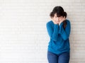 Portrait of beautiful young asian woman enjoy and happiness standing on gray cement texture grunge wall brick background Royalty Free Stock Photo