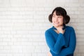 Portrait of beautiful young asian woman enjoy and happiness standing on gray cement texture grunge wall brick background Royalty Free Stock Photo