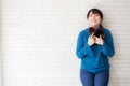 Portrait of beautiful young asian woman enjoy and happiness standing on gray cement texture grunge wall brick background Royalty Free Stock Photo