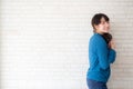 Portrait of beautiful young asian woman enjoy and happiness standing on gray cement texture grunge wall brick background Royalty Free Stock Photo