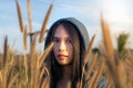 Portrait of beautiful young Asian woman enjoying nature on grass meadow at sunrise Royalty Free Stock Photo