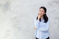 Portrait of beautiful young asian woman happiness standing on gray cement texture grunge wall background Royalty Free Stock Photo