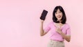 Portrait beautiful young asian woman happy smile showing smartphone screen with pointing finger hand gesture to mobile phone Royalty Free Stock Photo