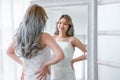 Portrait of Beautiful young Asian woman looking at mirror in the mirror healthy skin at home. Happiness Korean or Japanese