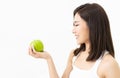 Portrait of a beautiful young Asian woman looks at hands holding green apple isolated on white background.Healthy food and people Royalty Free Stock Photo