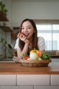 Portrait of beautiful young asian woman making salad at home. cooking food and Lifestyle moment Royalty Free Stock Photo