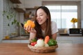 Portrait of beautiful young asian woman making salad at home. cooking food and Lifestyle moment Royalty Free Stock Photo