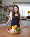 Portrait of beautiful young asian woman making salad at home. cooking food and Lifestyle moment Royalty Free Stock Photo