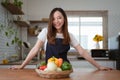 Portrait of beautiful young asian woman making salad at home. cooking food and Lifestyle moment Royalty Free Stock Photo