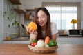 Portrait of beautiful young asian woman making salad at home. cooking food and Lifestyle moment Royalty Free Stock Photo