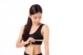 Portrait beautiful young asian woman measure tape with arm for weightloss with satisfied . Royalty Free Stock Photo