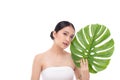 Portrait of beautiful young Asian woman with perfect body smooth skin beauty face natural make up in tropical green leaves Royalty Free Stock Photo