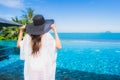 Portrait beautiful young asian woman relax in luxury outdoor swimming pool in hotel resort nearly beach sea ocean Royalty Free Stock Photo