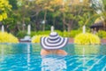 Portrait beautiful young asian woman relax smile leisure around outdoor swimming pool nearly sea beach ocean Royalty Free Stock Photo