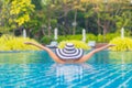 Portrait beautiful young asian woman relax smile leisure around outdoor swimming pool nearly sea beach ocean Royalty Free Stock Photo