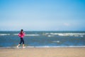 Portrait beautiful young asian woman running and exercising on the tropical outdoor nature beach sea ocean