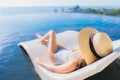 Portrait beautiful young asian woman smile happy relax around swimming pool in hotel resort with sea and ocean view Royalty Free Stock Photo