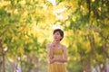 Portrait of beautiful young asian woman thinking against yellow Royalty Free Stock Photo