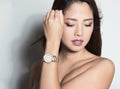 Portrait of beautiful young asian womanbeautiful young asian woman wearing a wrist wat Royalty Free Stock Photo