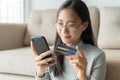 Portrait of Beautiful young Asian women are buying  online with a credit card. asia girl are using smartphone and making online Royalty Free Stock Photo