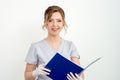 Beautician holding folder on white