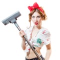 Portrait of beautiful young blond pinup woman holding vacuum cleaner looking in camera isolated on white copy space background Royalty Free Stock Photo