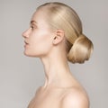 Portrait Of A Beautiful Young Blond Woman With Bun Hairstyle. Royalty Free Stock Photo