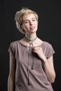 Portrait of a beautiful young blond woman wearing fashion statement necklace Royalty Free Stock Photo