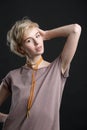 Portrait of a beautiful young blond woman wearing fashion statement necklace Royalty Free Stock Photo