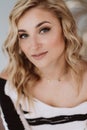 Portrait of a beautiful young blonde woman with clean fair skin. Industry of cosmetology and beauty. Soft selective focus Royalty Free Stock Photo