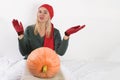 Portrait of beautiful young blonde woman with pumpkin ready for halloween celebration, mockup for postcard and invitation or adver